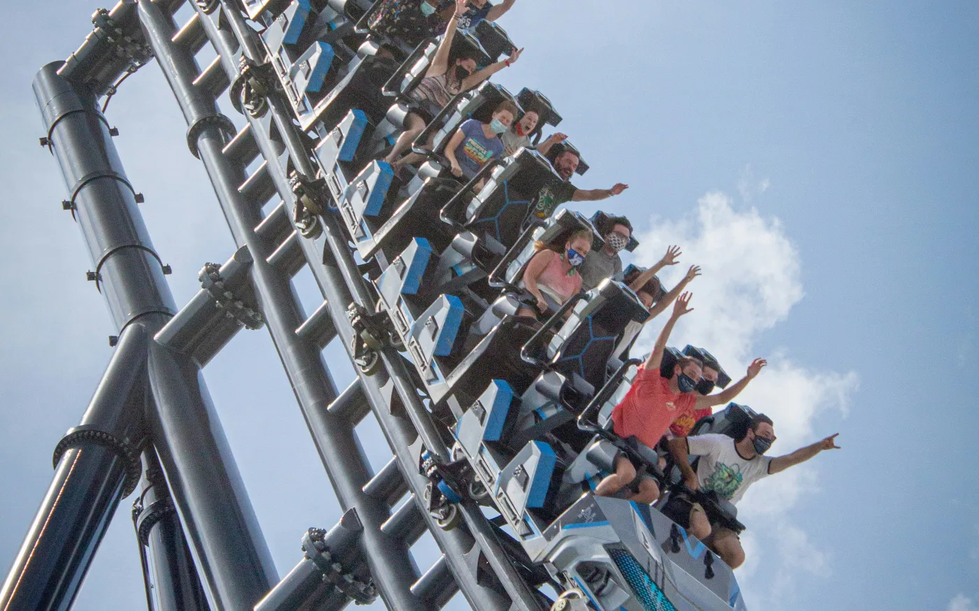 people riding on roller coaster during daytime by Itai Aarons courtesy of Unsplash.