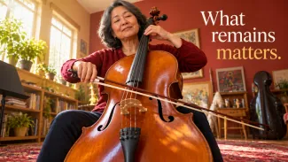 An older woman plays cello in a sunlit home music room beside the words “What remains matters.”