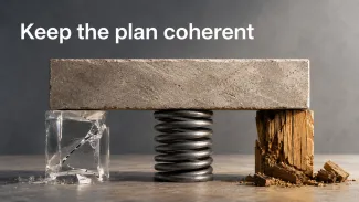 A stone beam rests on fractured crystal, a compressed metal spring, and stressed wood beneath the words “Keep the plan coherent.”