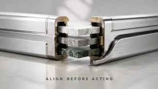Two interlocking metal rails connect around three aligned stone layers representing verified ownership, custody, and tax records.