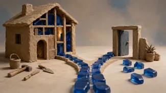 Handcrafted clay house with blue glass blocks built into its walls beside an open doorway and loose glass blocks, illustrating money committed to buying versus money kept available while renting.