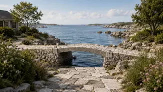 Stone footbridge leading toward open water, symbolizing the transition into an important Social Security claiming decision.