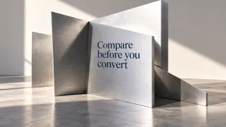 Angled aluminum panels cast different shadows in a sunlit gallery, with the words “Compare before you convert” on the front panel.