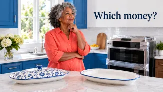 A woman considers a kitchen purchase beside a new oven, with the words “Which money?” above her.