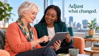 A retiree and advisor review a tablet together beside the words “Adjust what changed.”