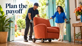 A woman welcomes delivery of a terracotta armchair at her home beside the words “Plan the payoff.”