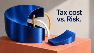 A section removed from a large blue sculpture reveals smaller white and gold curves beside the words “Tax, cost versus risk.”
