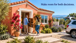 An older man and a woman carry a bookshelf into a coral-colored home beneath the words “Make room for both decisions.”