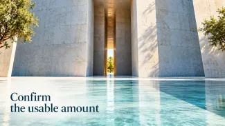 A narrow sunlit passage within a broad stone entrance appears above the words “Confirm the usable amount.”