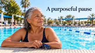 An older woman rests at the edge of a sunny swimming pool beneath the words “A purposeful pause.”