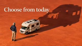 An older person considers a recreational vehicle casting an oversized shadow beneath the words “Choose from today.”