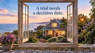 An open wooden window frames a coastal home beneath the words ‘A trial needs a decision date.’