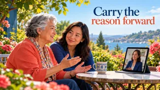 An older woman and her adult daughter speak with an advisor by video in a sunny garden, beneath the words “Carry the reason forward.”