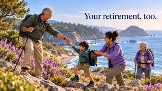 A grandfather helps his grandson up a coastal trail while two family members follow.