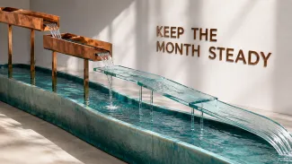 Copper channels and a narrowing glass bridge feed a continuous turquoise stream, representing retirement income beginning on different schedules.