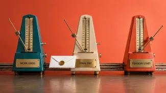 Three differently timed metronomes mark when work ends, final compensation arrives, and pension payments begin.