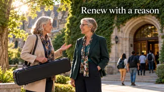 Two older women talk outside a university building beneath the words “Renew with a reason.”