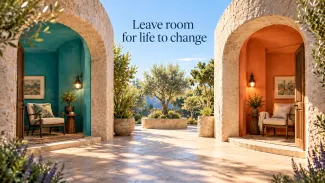 Turquoise and orange alcoves face a shared courtyard beneath the words ‘Leave room for life to change.’