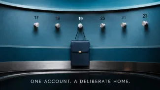 A small blue portfolio case remains on a numbered coat-check peg, representing an older retirement account that still needs a deliberate destination.