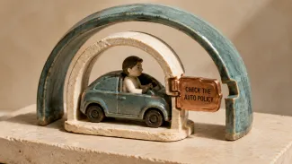 A ceramic car and driver sit beneath an auto-policy arch and a larger umbrella arch, joined by a clasp labeled Check the Auto Policy.